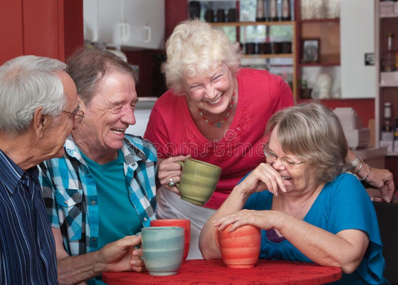 Laughing Friends in Coffeehouse