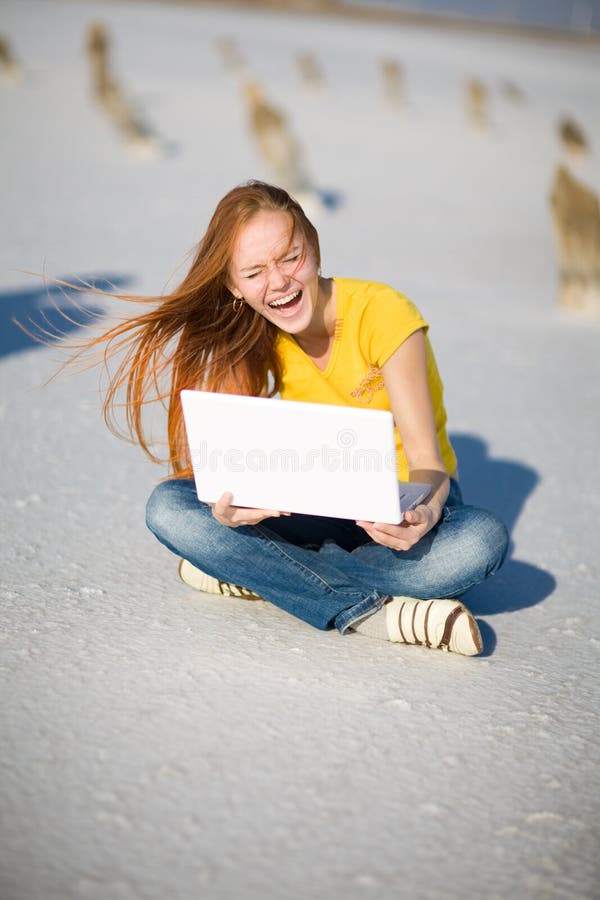 Laughing girl with notebook