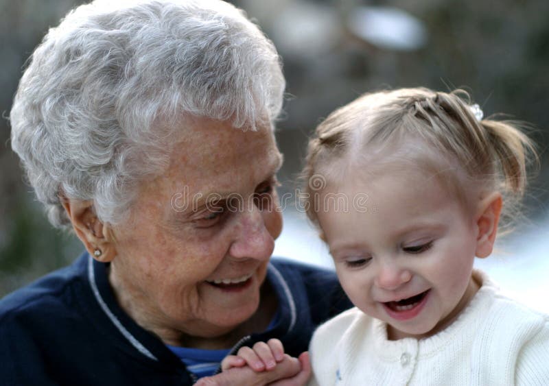 Sweet old woman shares a laugh with little child. Old granny stock images, royalty-free photos and pictures