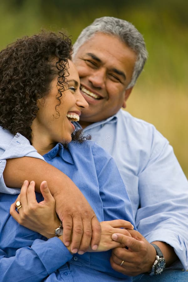 Laughing happy hispanic couple