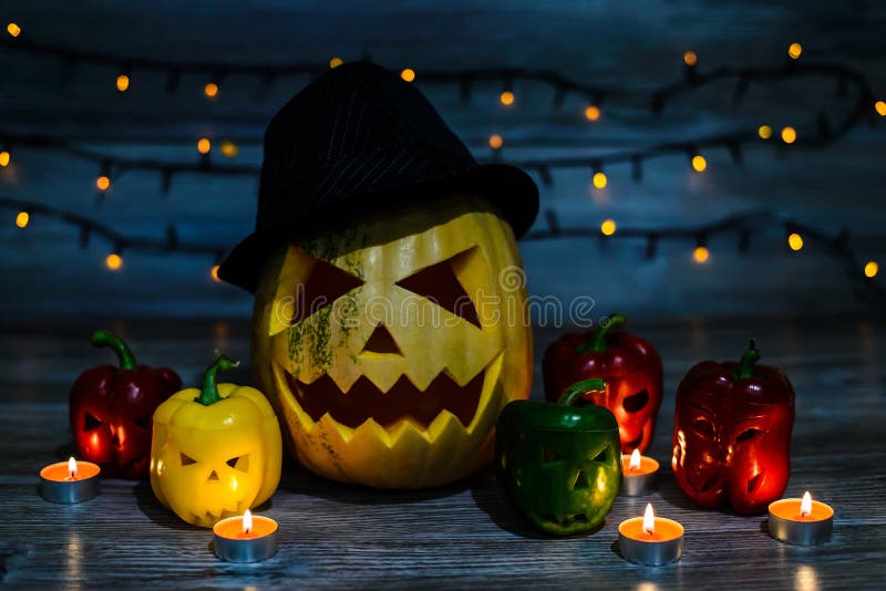 Laughing jack-o-lantern in hat with scary scar on the face and h stock photos Laughing jack-o-lantern in hat with scary scar on the face and h stock photos