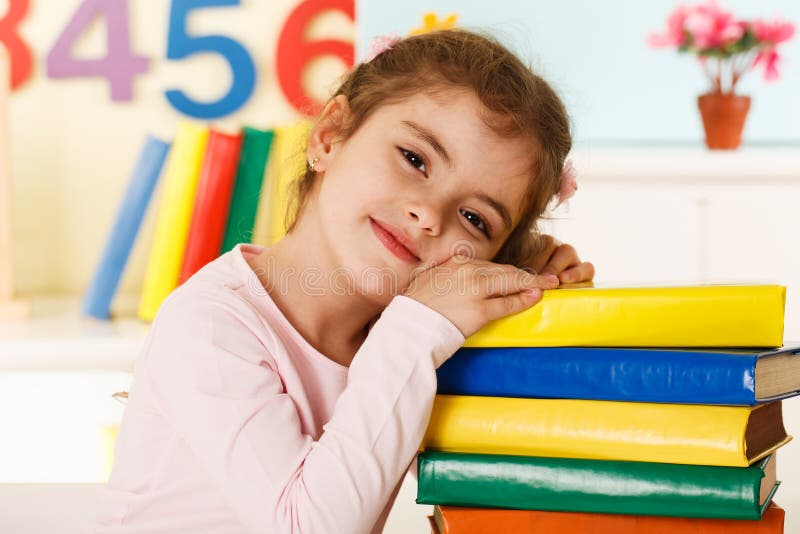 Laughing girl with books