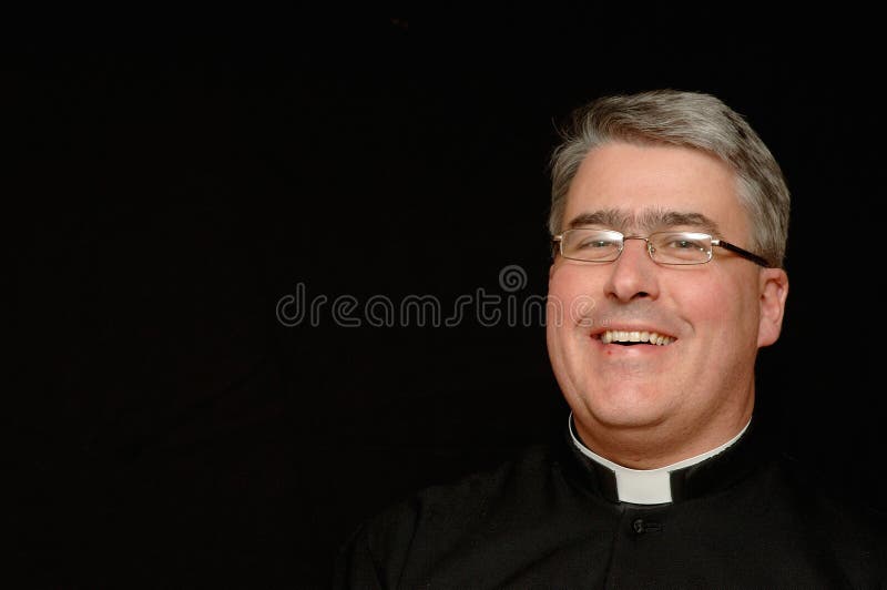 Middle-aged man of God with collar, laughing. Isolated on black background in horizontal format. Copy space available to left side of photo. Middle-aged man of God with collar, laughing. Isolated on black background in horizontal format. Copy space available to left side of photo.