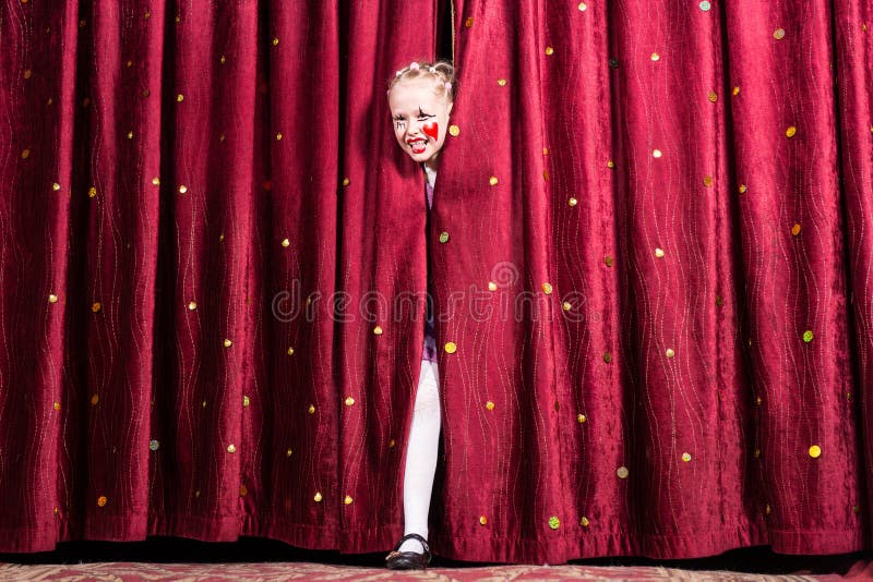Laughing young girl making her entry on stage