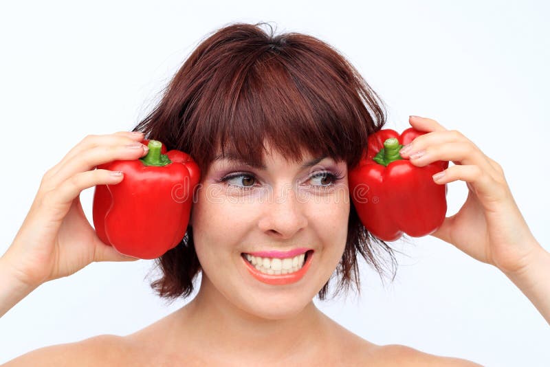 A laughing young woman is happy about a healthy diet