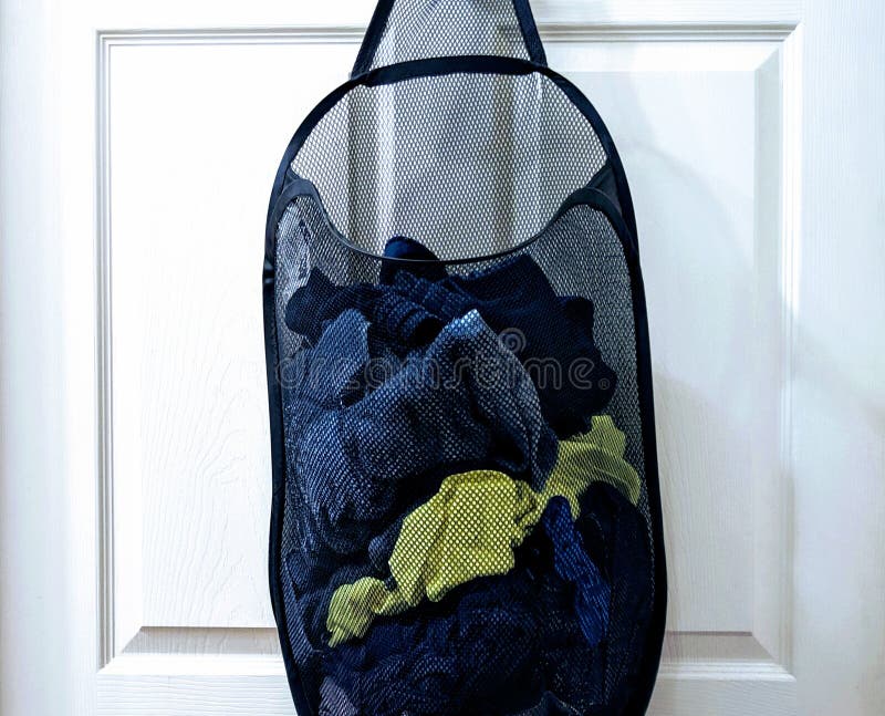 Laundry Basket Hanging on Back of White Door. Stock Image Image of