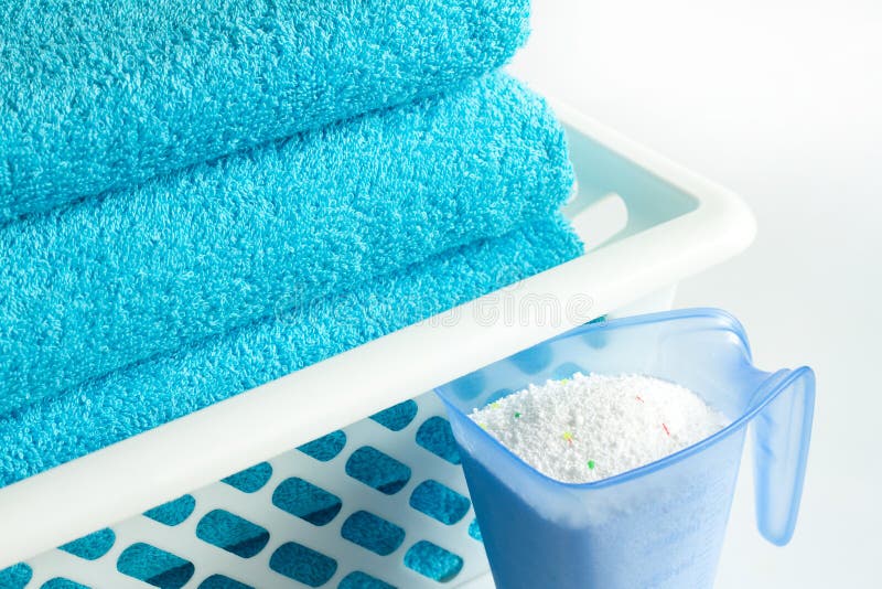 Laundry blue towels and washing powder stock photography