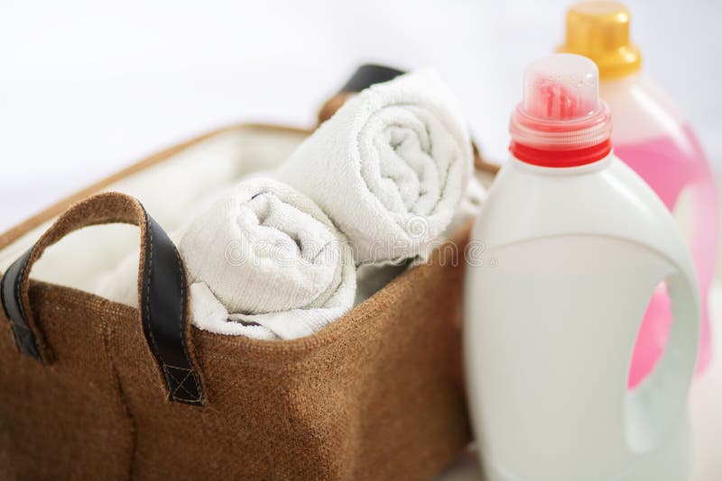 Laundry Detergent in Bottle, Laundry Conditioner and Basket with