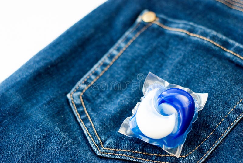 Laundry and Detergent Capsule Pod on Jeans Stock Image Image of gift