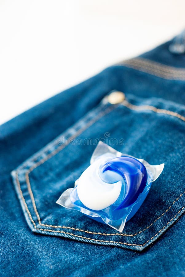 Laundry and Detergent Capsule Pod on Jeans Stock Image Image of