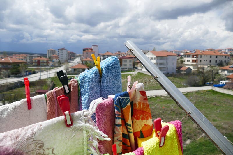 Laundry Drying on the Clothes Hanger on the Balcony, Clothes Hanging on the  Rope on the Balcony Stock Photo - Image of hanger, clean: 277325552