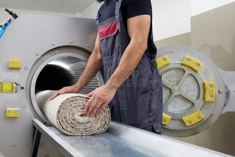 Man Operating Drying Machine for Carpet Cleaning. Professional Carpet