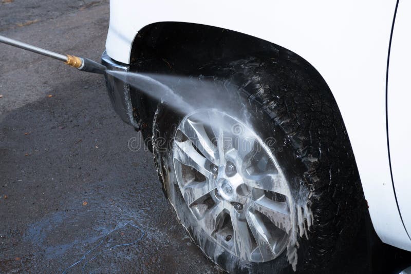 Car wheel wash car cleaning with water jet dirty. Car wheel wash car cleaning with water jet dirty