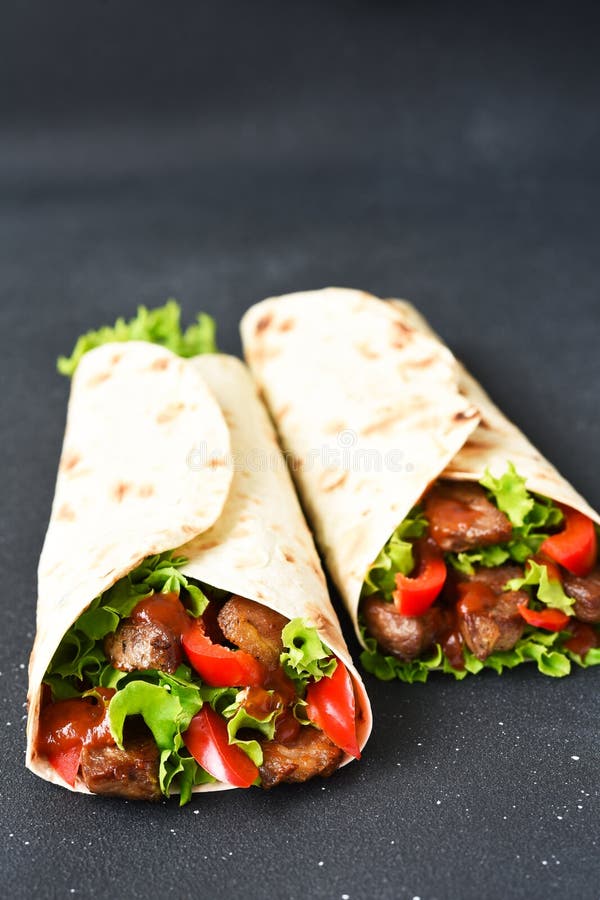 Lavash Appetizer with Lettuce, Meat and Sauce. Shawarma. Mexican Tacos