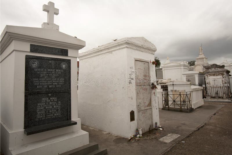 Grave of ruputed Voodoo Queen Marie Laveau defiled by tourists and practitioner in St Louis Cemetary No 1 New Orleans. Grave of ruputed Voodoo Queen Marie Laveau defiled by tourists and practitioner in St Louis Cemetary No 1 New Orleans.