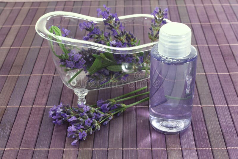 Lavender oil bath with flowers and leaves