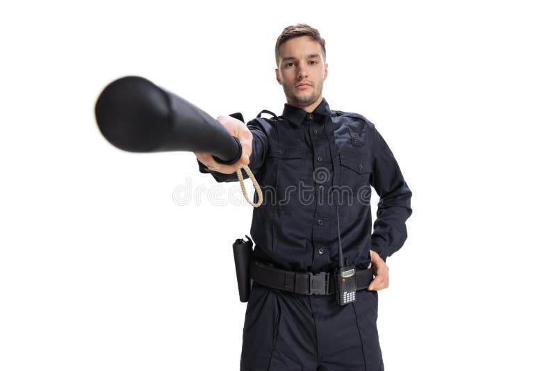 Front camera view. Young male policeman officer wearing black uniform looking at camera isolated on white background