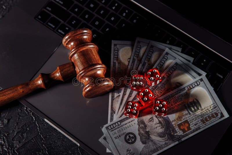 Law and Rules for Online Gambling Concept, Judge Gavel and Dice Stock