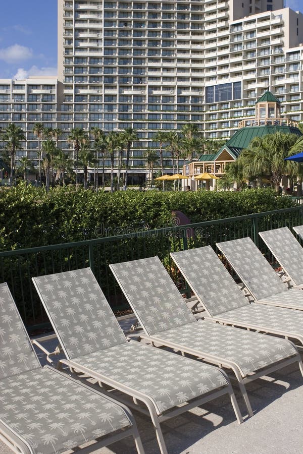 Lawn chairs at a hotel stock image. Image of chairs, building 21179865