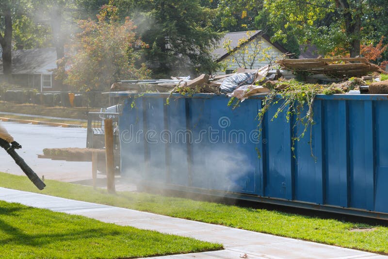lawn-grass-rolls-pallets-against-street-rolled-ready-laying-loaded-dumpster-near-construction-urban-landscape-176507368.jpg