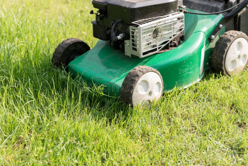 Lawn Mower in the Garden at Work Stock Image Image of mower