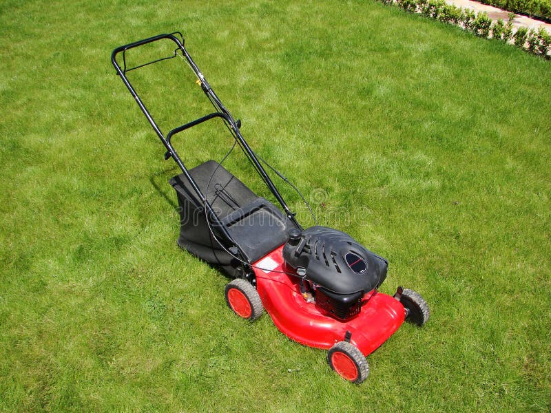 Lawn mower in grass stock photo. Image of wire, cambric 5904854