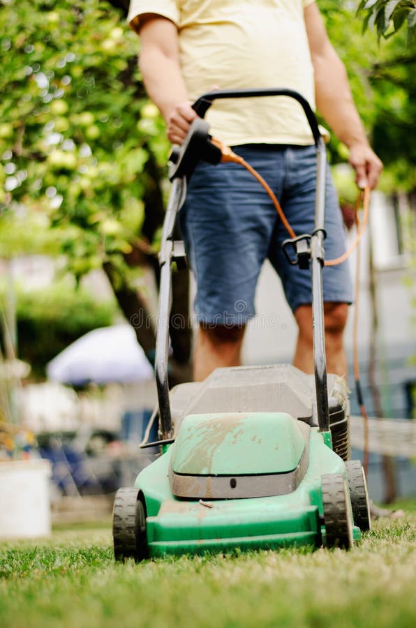 Lawn mowing royalty free stock photos