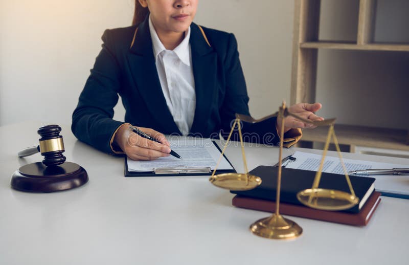 Lawyer is explaining about the wrongdoing laws regarding fraud to the client at the office