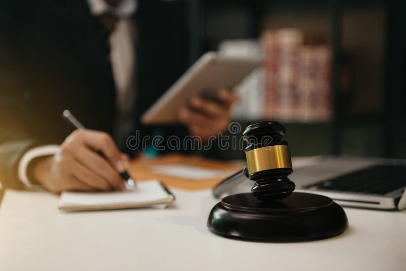 Lawyer in Office. Businessmen Sitting at Desk and Making Notes Stock