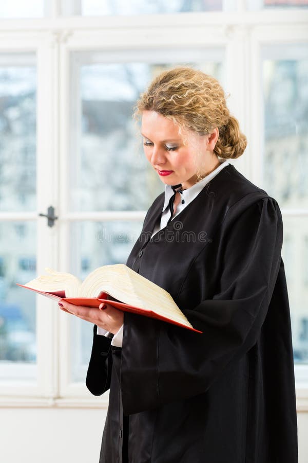 Lawyer in Office with Law Book Reading by Window Stock Image Image of