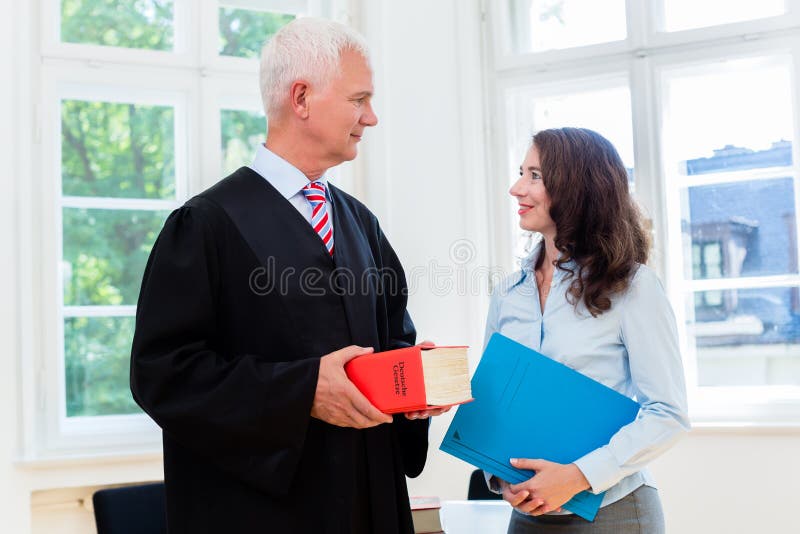 Lawyer and paralegal in their law office