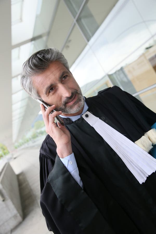 Lawyer in Front of the Courthouse Talking on the Phone Stock Photo