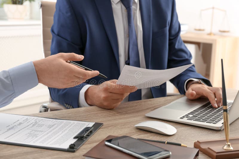 Lawyer Working with Client at Table in Office, Stock Image Image of