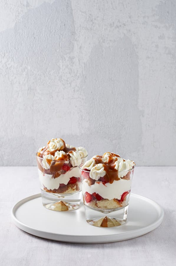 Layered dessert Trifle with vanilla cake, whipped cream, salted caramel and fresh strawberry stock photos Layered dessert Trifle with vanilla cake, whipped cream, salted caramel and fresh strawberry stock photos