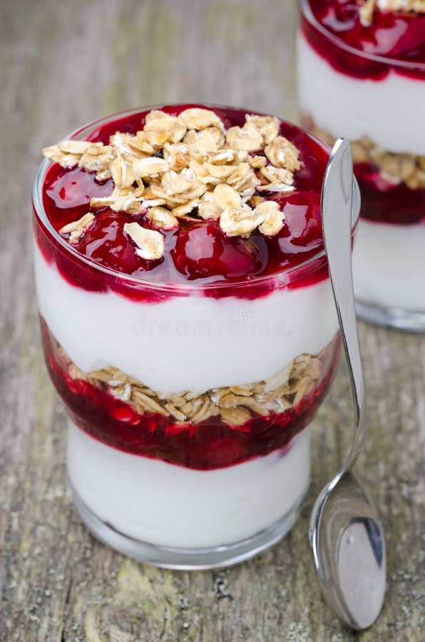 Layered Dessert with Yogurt, Granola and Cherry, Closeup Stock Photo