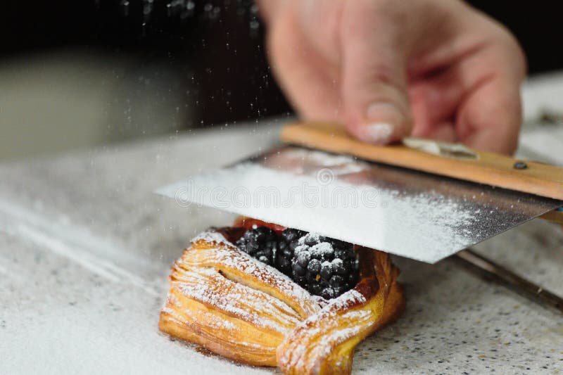 Layered loaf with blackberries and powdered sugar