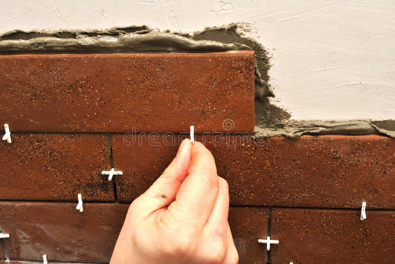 Laying Ceramic Tiles stock image. Image of decorating 17025999