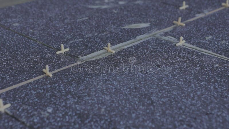 Laying ceramic tiles. repair work. Freshly laid tiles on the floor stock video