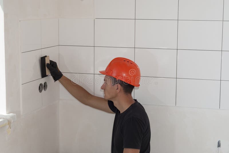 Man Installing Ceramic Tile in Bathroom Stock Photo Image of