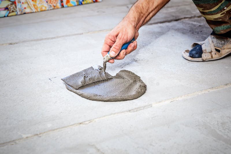 Laying floor ceramic tile stock image. Image of concrete 115573233