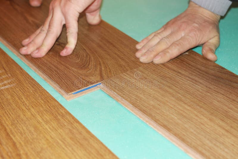 Laying laminate flooring stock photo. Image of flooring 17318996