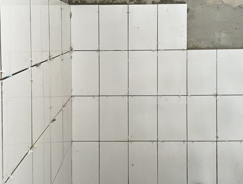 Laying of New Ceramic Tiles on the Wall, Beginning of Laying Tiles on