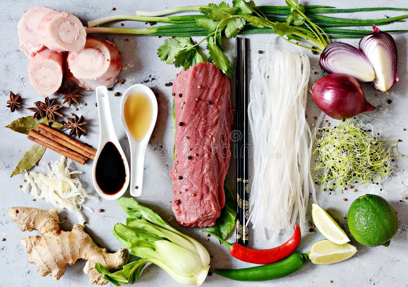 Layout of products on Vietnamese Pho Bo soup on gray background. royalty free stock photography.