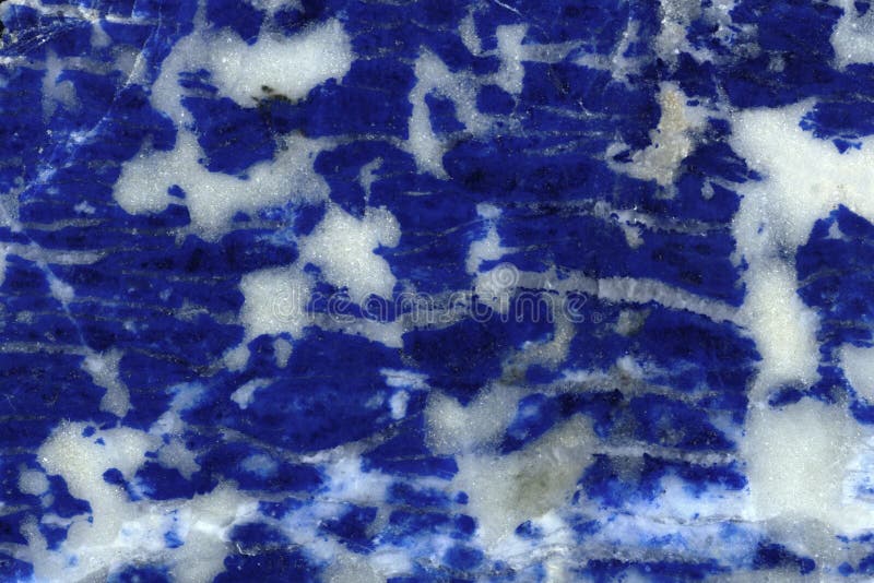 White-blue decorative stone background. Lazurite is a symbol of success and sincerity.