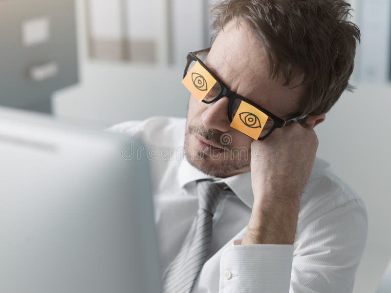 Lazy office worker wearing sticky notes over his glasses