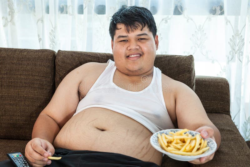 Lazy Overweight Male Sitting With Fast Food Stock Photo ...