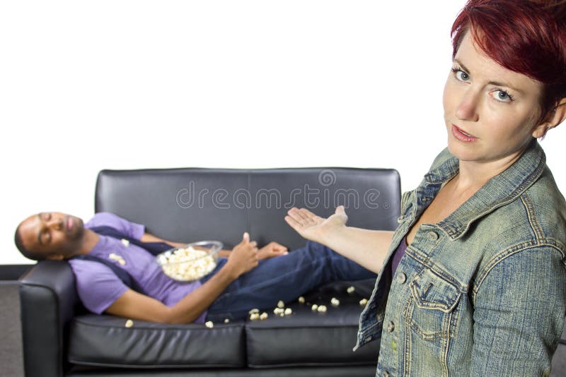 Lazy Roommate. Female angry at lazy male roommate making a mess stock photos