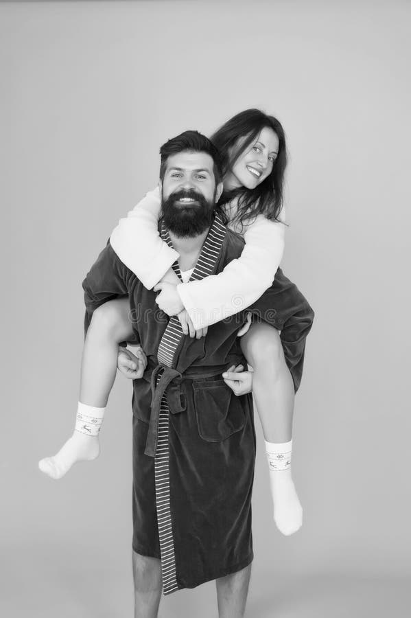 Lazy weekend. romantinc couple in love. woman and man in robe. Perfect morning. Having fun. Happy family weekend stock photography Lazy weekend. romantinc couple in love. woman and man in robe. Perfect morning. Having fun. Happy family weekend stock photography