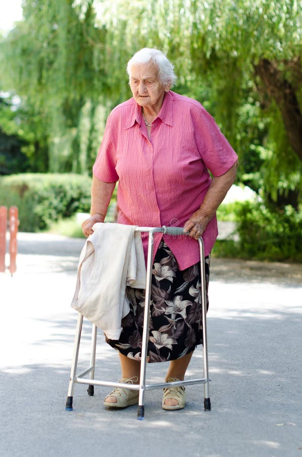 Elderly woman with walker stock photo. Image of aged, lane 8962694