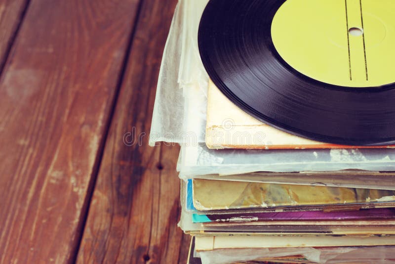 Records stack and old record. vintage filtered. Records stack and old record. vintage filtered.